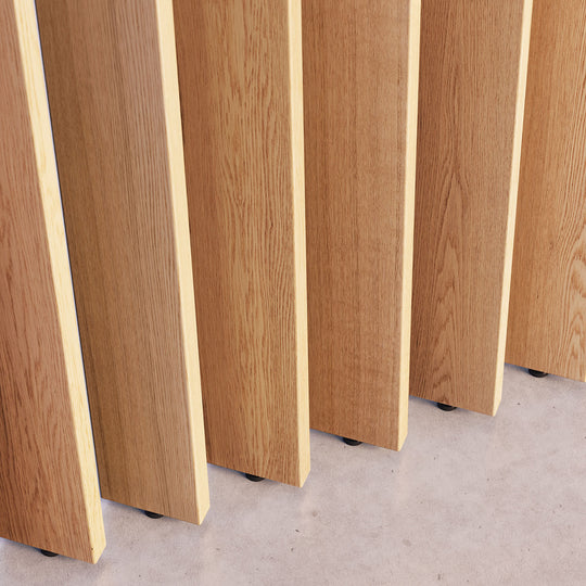 Close-up of wooden room divider slats arranged at a 45 degree angle