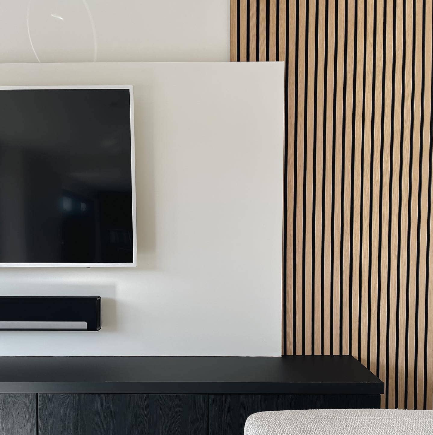 modern tv wall with soundbar and acoustical wood slat wall panels