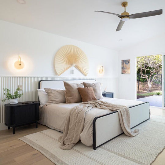 modern white bedroom with wal sconces and ribbed white wall paneling