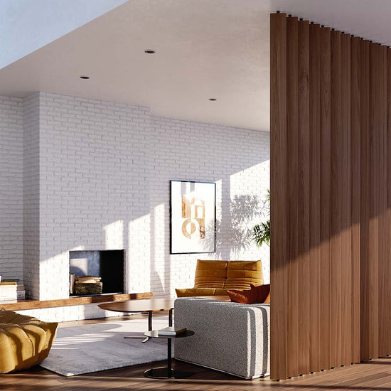 midcentury living room with vintage furniture and a floor-to-ceiling walnut vertical wood slat room divider