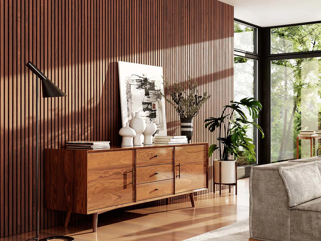 Modern living room with decorative wood wall panels, featuring a mid-century sideboard and large windows, showcasing a stylish makeover idea.