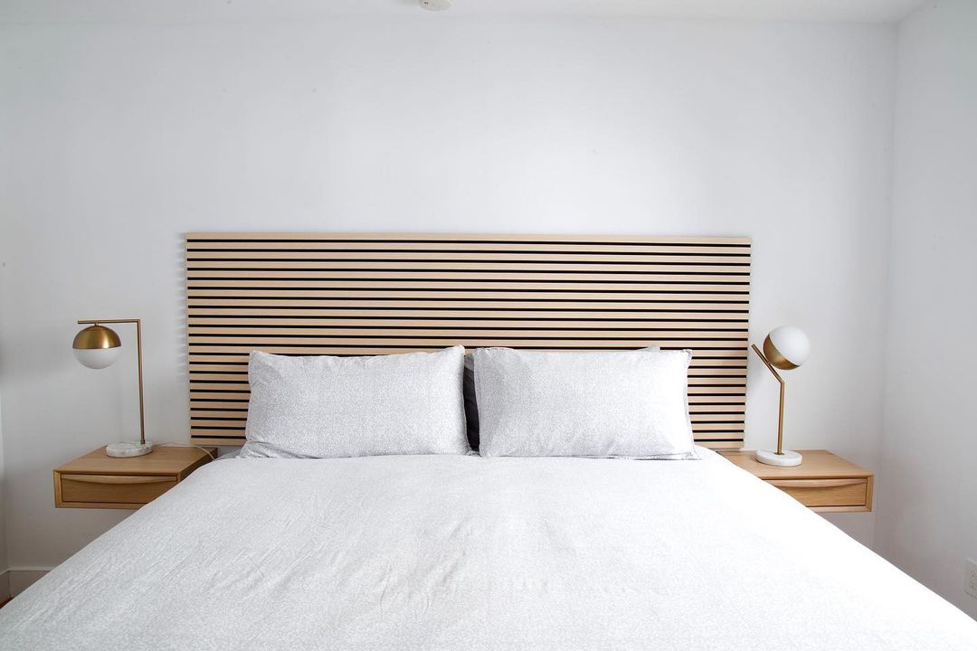 vertical wood slat accent wall in modern bedroom