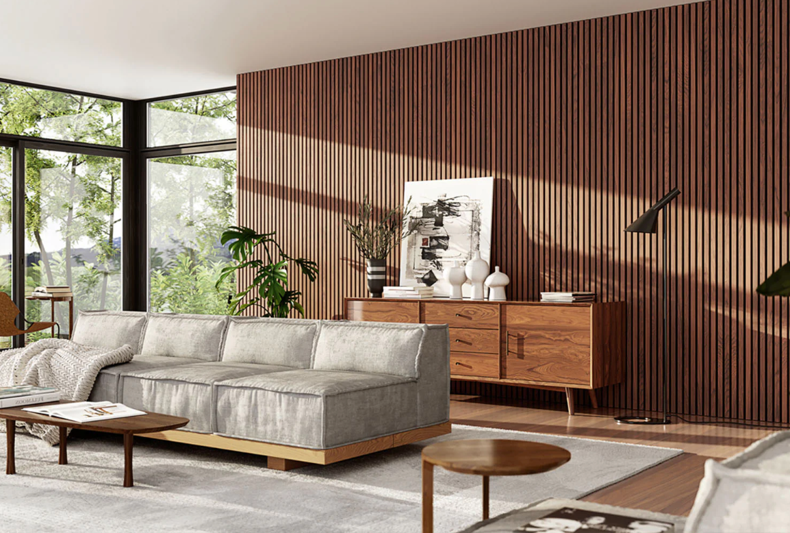 Modern living room with large windows, grey sofa, and accent wood wall panels behind a mid-century sideboard, blending indoor and outdoor elements seamlessly.