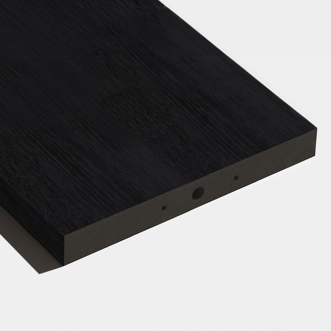 A pre-drilled wood slat for a room divider laying on white studio background