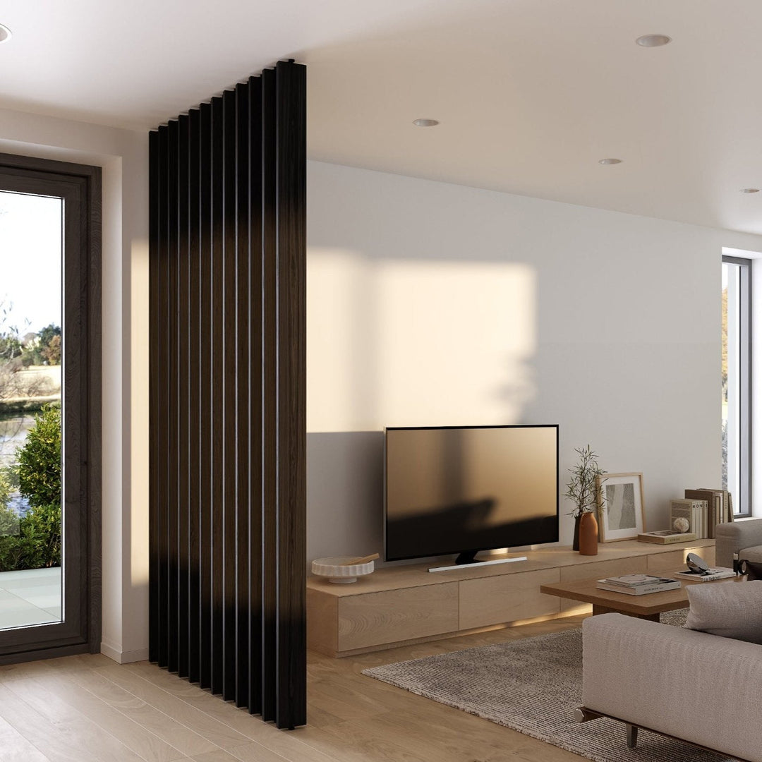 black rotating wood slat room divider in modern living room between tv and entrance