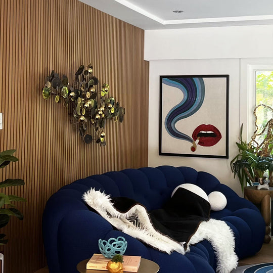 midcentury modern living room with oak wood slat wall paneling behind couch