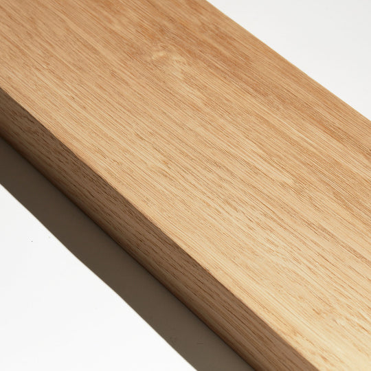 sample of oak wood slat room divider against white background