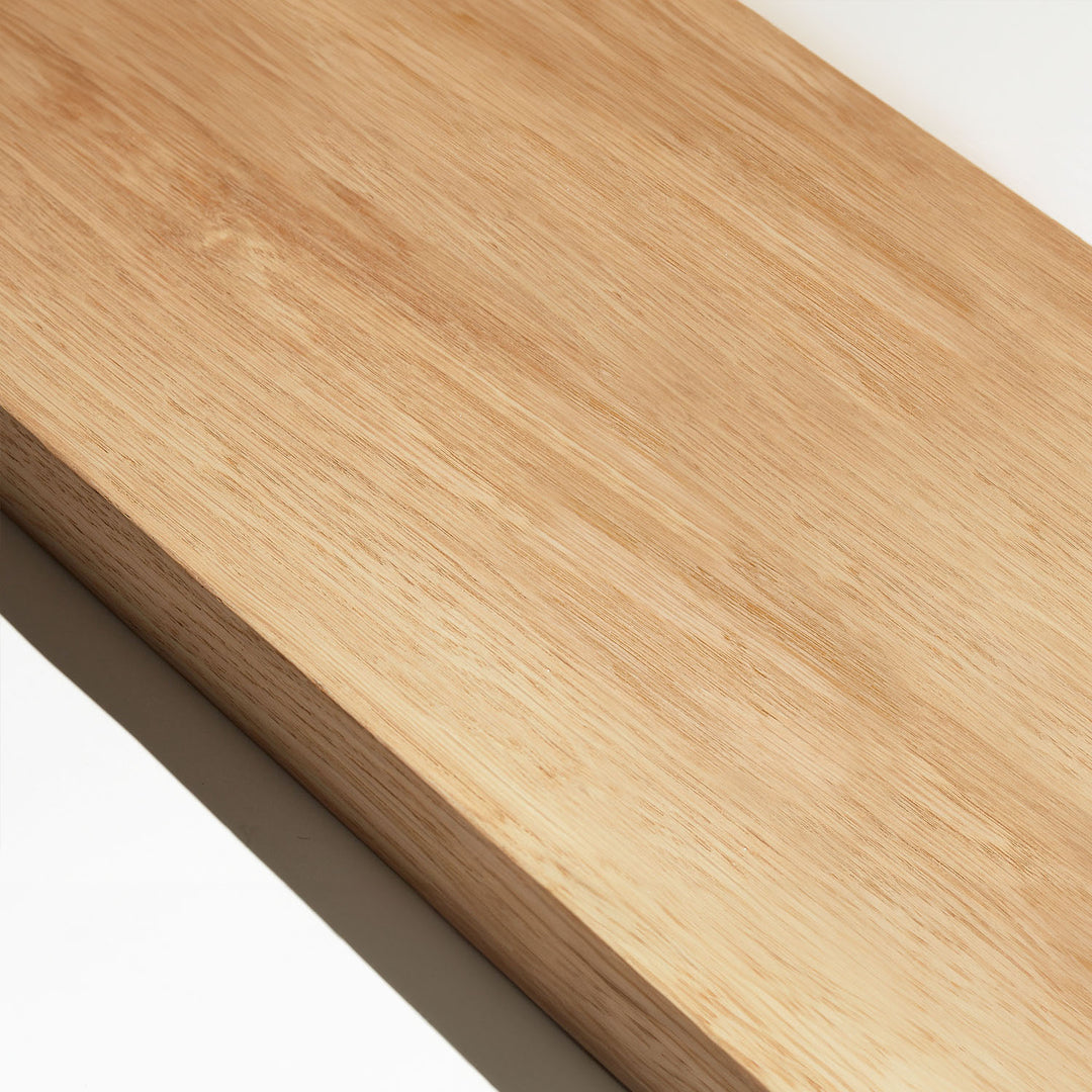 Close-up of a wooden room divider slat in white oak finish with visible grain pattern.