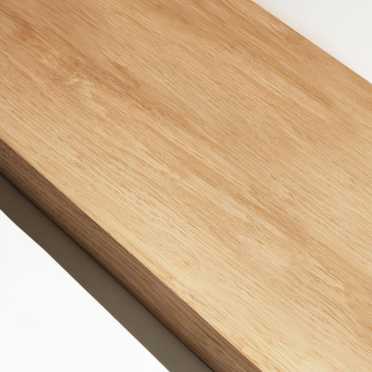 Close-up of a wooden room divider slat in white oak finish with visible grain pattern.