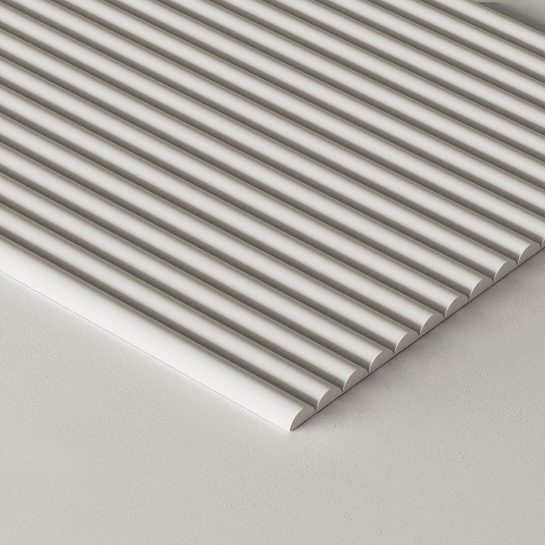 A close-up of a paintable tambour panel shown at an angle on a light gray surface.