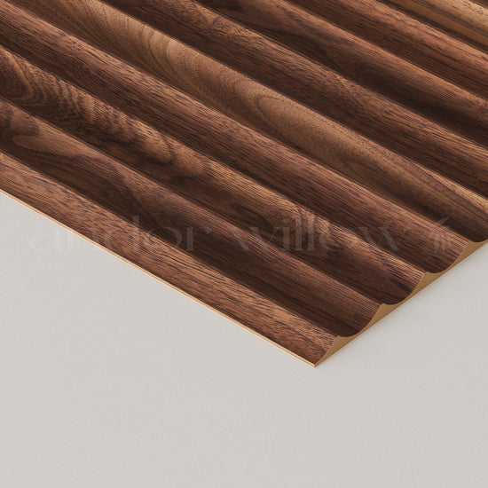 close-up studio image of fluted walnut wall panelling on white background