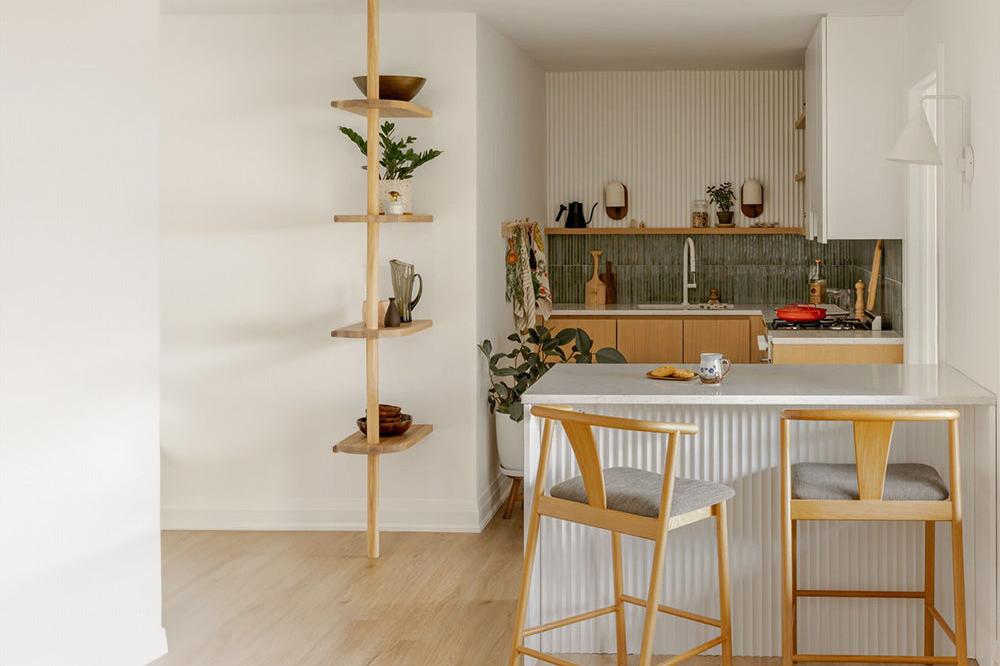 modern farmhouse kitchen with white fluted wall panels and green tiles