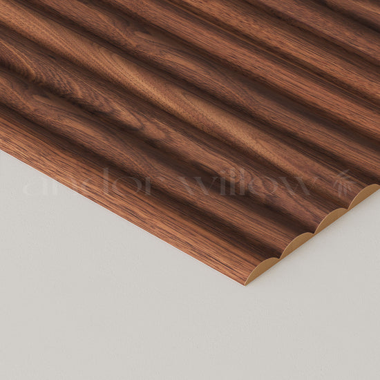 close-up studio image of ribbed walnut wall panelling on white background