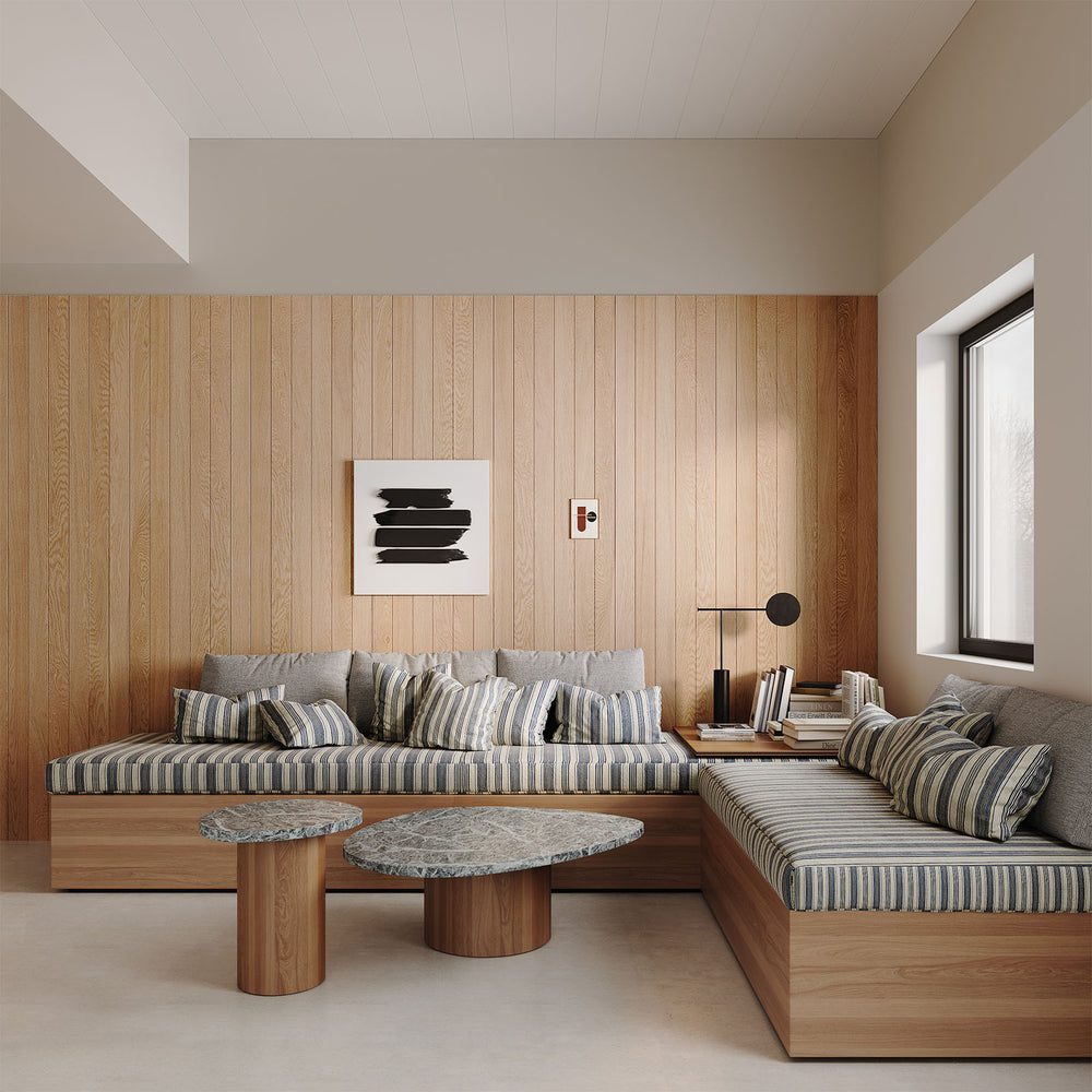 Modern living room with wooden plank walls, sectional sofa, and decorative modern wall art.