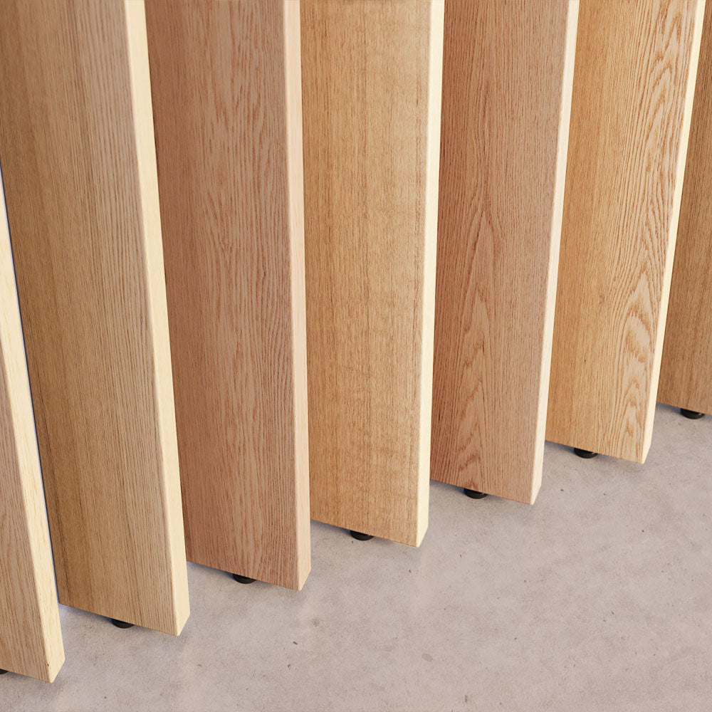 closeup image of vertical white oak slats that rotate as part of a wood slat partition system