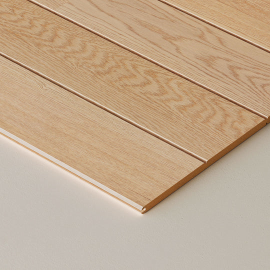 Close-up of wooden wall planks on a neutral background