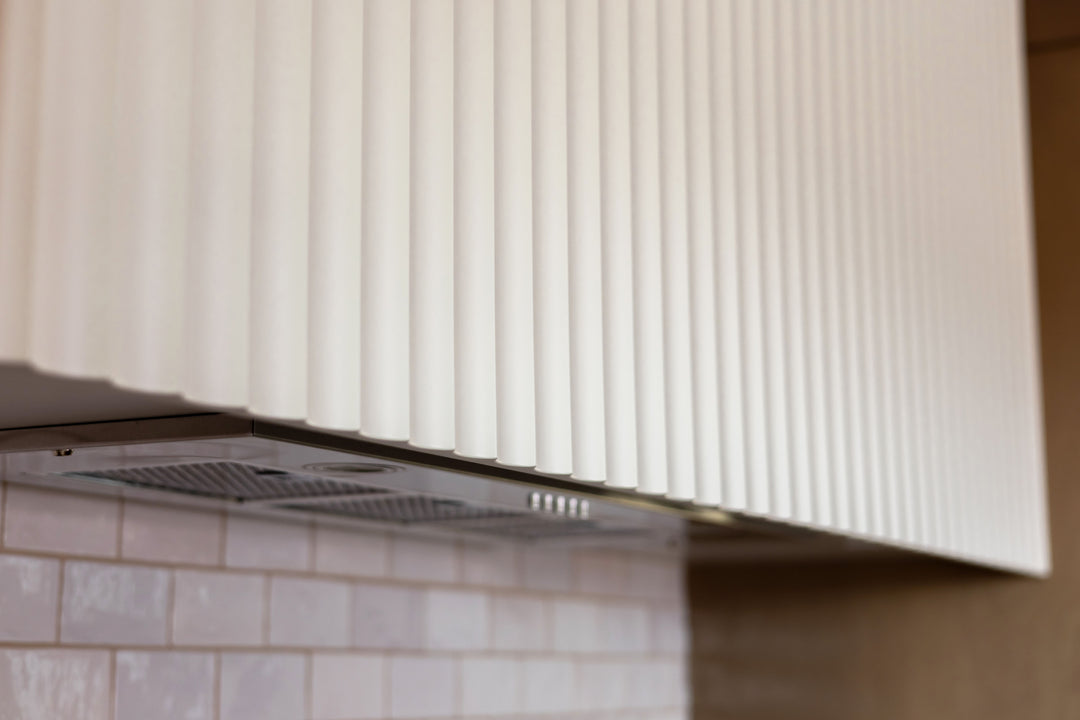 closeup kitchen range hood with fluted panelling detail