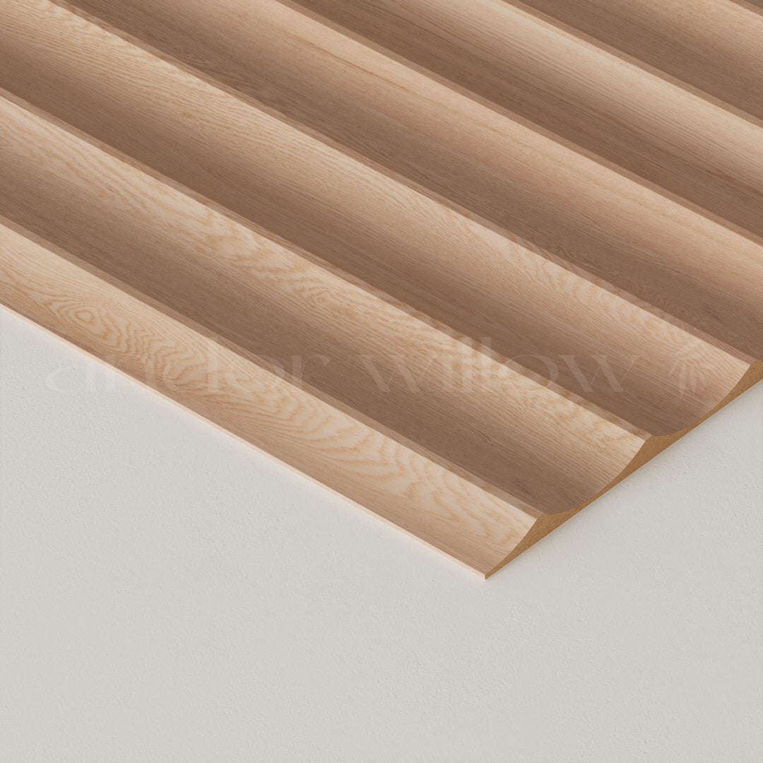 close-up studio image of wide fluted oak wall panelling on white background