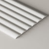 Close up studio image of wide ribbed paintable mdf wall panel