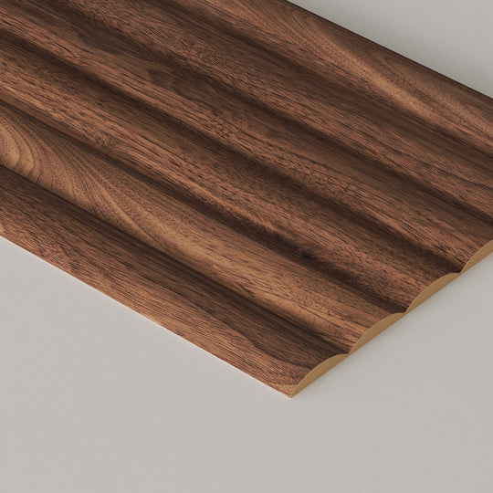fluted walnut wall paneling on a grey background