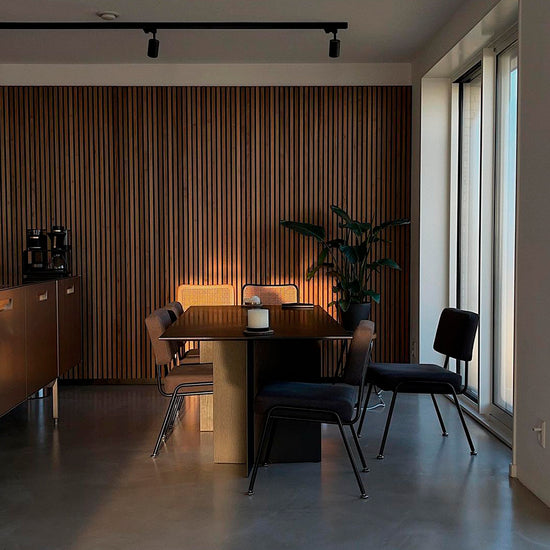 midcentury modern dining room with a vertical walnut wood slat feature wall