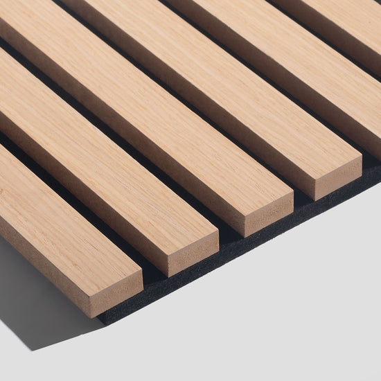 closeup image of white oak wood slat acoustic panels with black felt