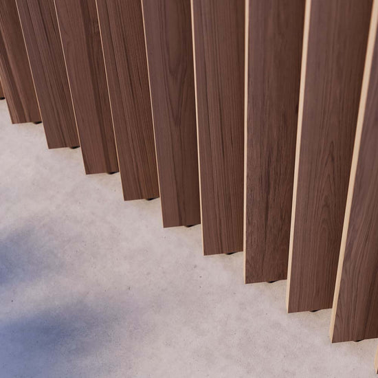 closeup image of vertical walnut slats that rotate as part of a wood slat partition system